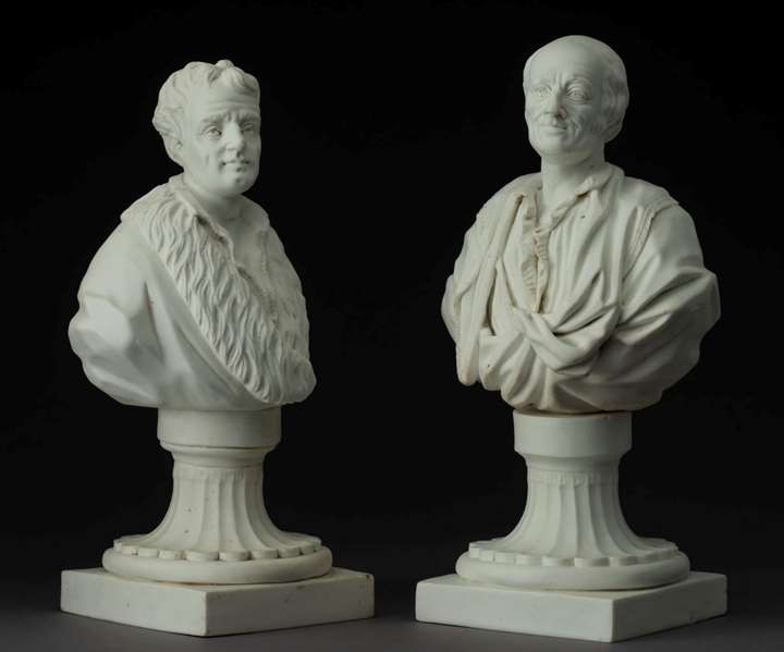 Two portrait busts of Rousseau and Voltaire